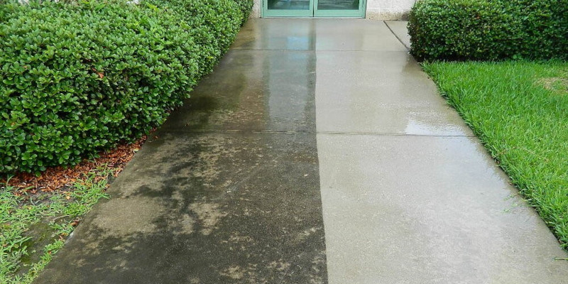 Concrete walkway before and after cleaning — stained and dirty on left, bright and clean on right